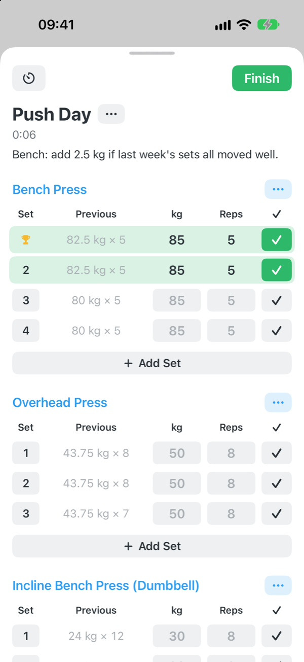 Logging a workout: sets with previous weights, and completed sets in green
